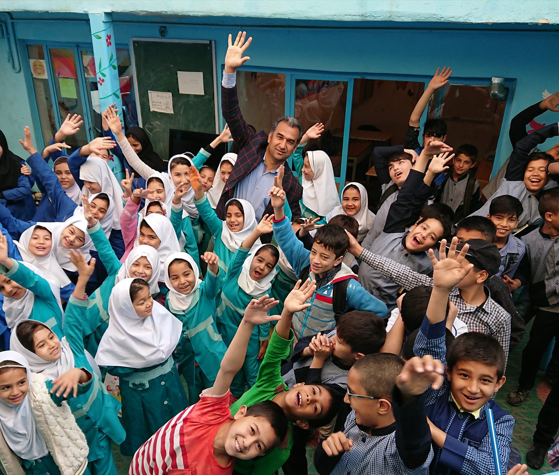 Students greeting a visitor at the school